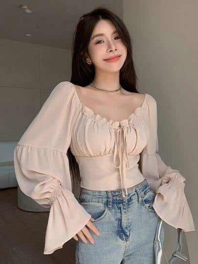 Blouse en mousseline à col froncé